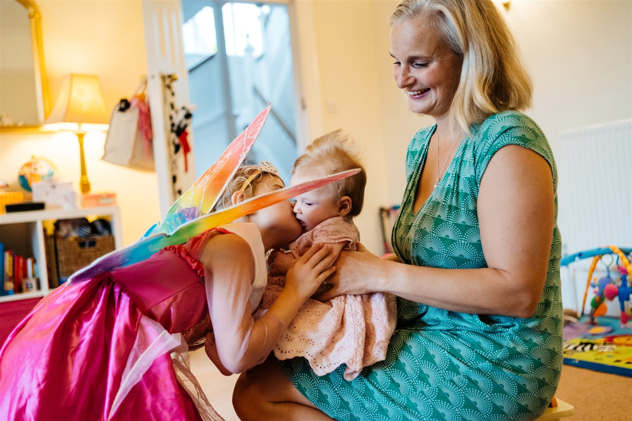 two sisters and their mum playing in fancy dress top tips for a heartwarming family photo shoot